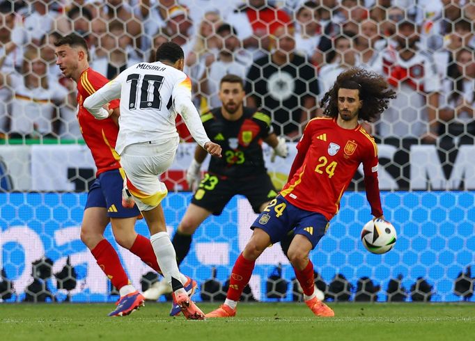 Soccer Football - Euro 2024 - Quarter Final - Spain v Germany - Stuttgart Arena, Stuttgart, Germany - July 5, 2024 Germany's Jamal Musiala shoots at goal and hits the arm