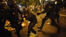 A protester yells as she is dragged away by riot police outside the Spanish parliament in Madrid, September 25, 2012. Protesters clashed with police in Spain's capital on Tuesday as the government prepares a new round of unpopular austerity measures for the 2013 budget that will be announced on Thursday. REUTERS/Susana Vera (SPAIN - Tags: CIVIL UNREST POLITICS) Published: Zář. 25, 2012, 8:25 odp.