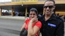 Niurka Gonzalez (L), cries while saying goodbye to her son Luis Salgado, nicknamed Chucho, as he prepares to board a flight to Miami, outside the Havana airport terminal March 13, 2013. Chucho was granted a U.S. visa based on his father's status as legal resident in Texas, and he was reunited in Miami with his father, Jesus Salgado, who had escaped Cuba on a frail boat ten years earlier. The Salgados are among many Cubans taking advantage of Cuba's new travel policy in place since last January, which allows citizens to leave the country with just a passport and no need for much-hated exit visas required since 1961. Picture taken March 13, 2013. REUTERS/Desmond Boylan (CUBA - Tags: POLITICS SOCIETY) Published: Dub. 11, 2013, 1:58 odp.