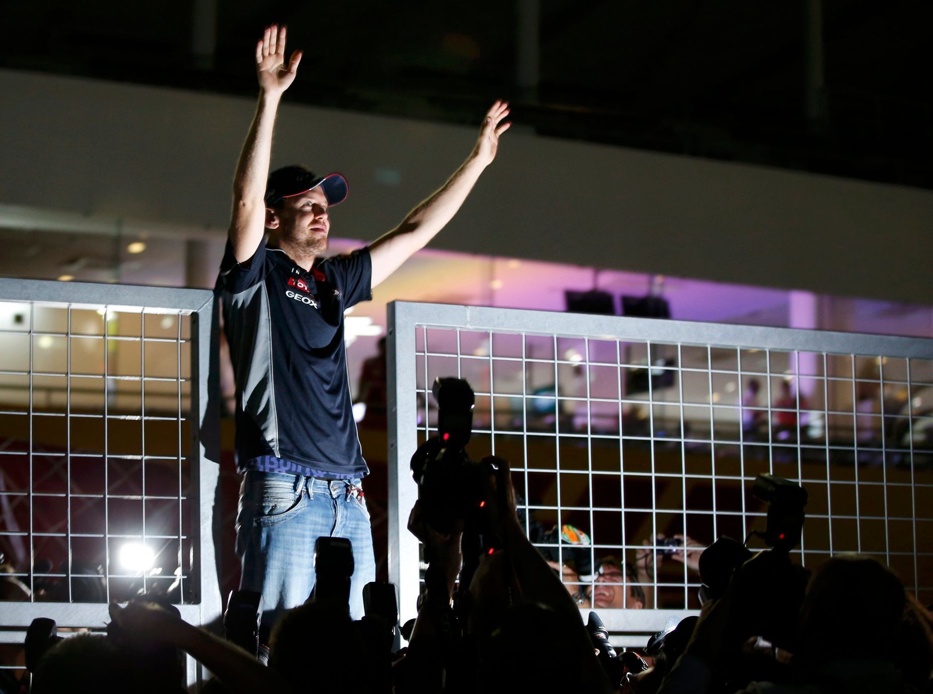 Red Bull Formula One driver Vettel of Germany waves to fans after winning the Japanese F1 Grand Prix at the Suzuka circuit