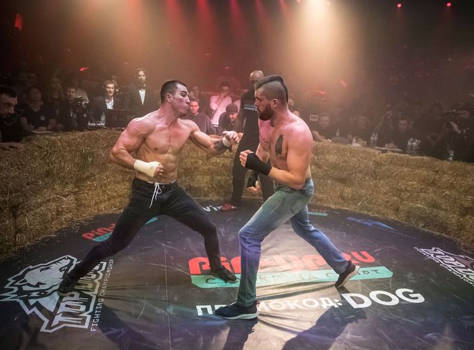 Rustam "Asteroid" and Anton "Charon" fight during the "Top Dog" bare-knuckle boxing tournament in Moscow, Russia April 16, 2021. Picture taken April 16, 2021. REUTERS/Sha