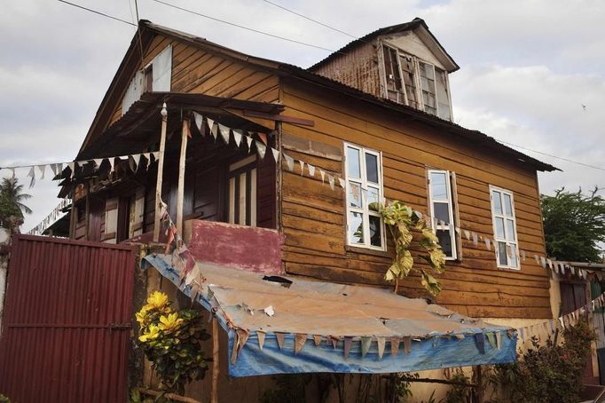 Old wooden planks cover facade of traditional colonial-era Board House in Murray Town of Sierra Leone's capital Freetown