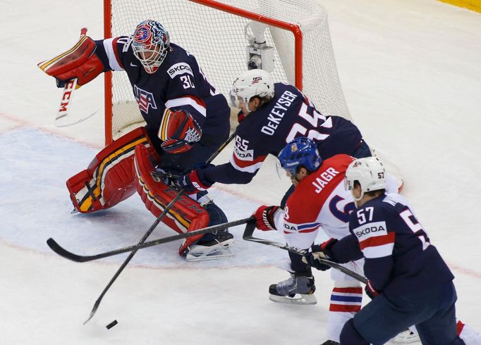 Jaromir Jagr of the Czech Republic (C) chases the puck during their men's ice hockey World Championship quarter-final game against the U.S. at Chizhovka Arena in Minsk Ma