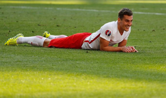 Poland's Arkadiusz Milik looks dejected after missing a opportunity to score