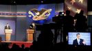 U.S. President Barack Obama answers a question as Republican presidential nominee Mitt Romney (L) listens during the first presidential debate in Denver October 3, 2012. REUTERS/Larry Rubenstein (UNITED STATES - Tags: POLITICS ELECTIONS USA PRESIDENTIAL ELECTION) Published: Říj. 4, 2012, 2:31 dop.