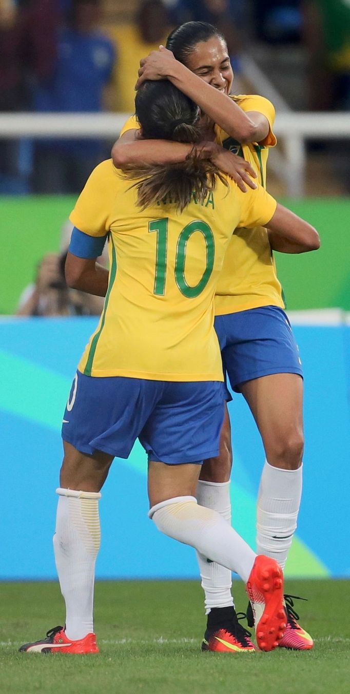 Marta (BRA) of Brazil embraces Andressa Alves (BRA) of Brazil after she scored the second goal.