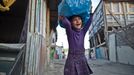 23 Titulek: Albanian gypsies face poverty in Greece Popis: October 22, 2011, Athens, Greece: October 22, 2011- Botanikos, Athens, Greece: 10 years old Zosefine carries a plastic bag with toys that she collected from the streets and garbage. Zosefine, was born in Botanikos Roma' township after the arrival of her parents from the Albanian gypsy-city El Basan. Majority of migrant Albanian gypsies use tourist visa which renew every six months, otherwise they become illegal. Gypsies' relocation from this Botanikos' private and occupied land to another place in order to find clean water, sanitary and schools, seems impossible due to the Greek crisis. In October 2013, an unidentified girl, called "Maria," was found in a Greek gypsy camp and could be related to missing child cases. Over 8,000 calls about the girl from all over the world including the U.S. and Canada have been received inquiring about the child. The blond girl, approximately age 4, was found in a Roma gypsy settlement in central Greece. DNA tests proved that she was not related to the 39-year-old man and 40-year-old woman who claimed to be her parents.