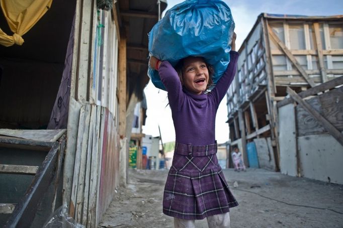 23 Titulek: Albanian gypsies face poverty in Greece Popis: October 22, 2011, Athens, Greece: October 22, 2011- Botanikos, Athens, Greece: 10 years old Zosefine carries a plastic bag with toys that she collected from the streets and garbage. Zosefine, was born in Botanikos Roma' township after the arrival of her parents from the Albanian gypsy-city El Basan. Majority of migrant Albanian gypsies use tourist visa which renew every six months, otherwise they become illegal. Gypsies' relocation from this Botanikos' private and occupied land to another place in order to find clean water, sanitary and schools, seems impossible due to the Greek crisis. In October 2013, an unidentified girl, called "Maria," was found in a Greek gypsy camp and could be related to missing child cases. Over 8,000 calls about the girl from all over the world including the U.S. and Canada have been received inquiring about the child. The blond girl, approximately age 4, was found in a Roma gypsy settlement in central Greece. DNA tests proved that she was not related to the 39-year-old man and 40-year-old woman who claimed to be her parents.