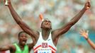 FILE PHOTO: Carl Lewis celebrates winning the 4x100m relay at the Olympics in Barcelona, Spain September 1992. REUTERS/Gary Hershorn/File Photo