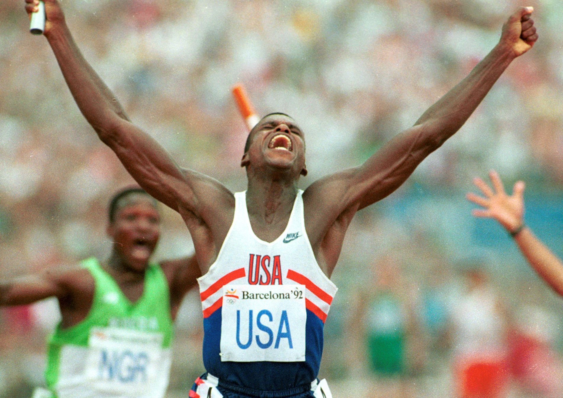 FILE PHOTO: CARL LEWIS CELEBRATES WINNING RELAY AT BARCELONA OLYMPICS.