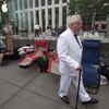 A man, dressed up as Colonel Sanders, walks outside the Apple Store in advance of an Apple special event, in the Manhattan borough of New York