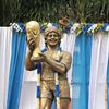 A garlanded statue of Argentine soccer great Diego Maradona is seen before a prayer meeting, in Kolkata