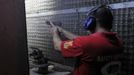 A worker test fires a newly produced caliber 45 pistol at Shooters Arms, a gun manufacturing company exporting different kinds of weapons to other countries, in Cebu city in central Philippines July 7, 2012. In the Philippines, they vote with their trigger fingers. Elections mean big business for illegal gunsmiths, who are looking forward to 2013 mid-term polls. With election-related violence commonplace, the Philippines imposes a ban on the carrying of guns for six months, from campaigning to the proclamation of winners. Picture taken July 7, 2012. To match Feature PHILIPPINES-GUNS/ REUTERS/Erik De Castro (PHILIPPINES - Tags: SOCIETY POLITICS BUSINESS CRIME LAW) Published: Čec. 29, 2012, 2:35 dop.