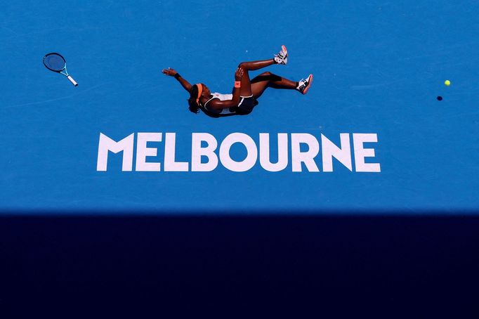 Tennis - Australian Open - Melbourne Park, Melbourne, Australia - January 22, 2023  Coco Gauff of the U.S. falls during her fourth round match against Latvia's Jelena Ost