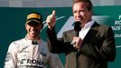 Race winner Mercedes Formula One driver Lewis Hamilton of Britain (L) stands next to actor Arnold Schwarzenegger during the podium ceremony of the Australian F1 Grand Pri