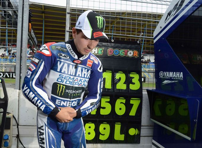 Yamaha MotoGP rider Jorge Lorenzo of Spain arrives at the pits for the first practice of the Dutch Grand Prix in Assen June 29, 2013. Lorenzo will undergo medical checks