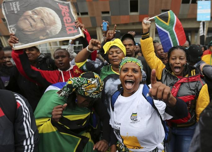 People arrive at the First National Bank (FNB) Stadium, also known as Soccer City, ahead of the national memorial service for late former South African President Nelson M