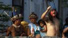 Members of the native Indian community living at the Brazilian Indian Museum wait on a wall inside the museum in Rio de Janeiro, March 22, 2013. Brazilian military police took position early morning outside the abandoned museum, where the community of around 30 native Indians have been living in since 2006. The community was ordered to leave the museum in 72 hours by court officials since last week, local media reported. Most of the Indians later left the museum after making a deal with the authorities. REUTERS/Pilar Olivares(BRAZIL - Tags: POLITICS CIVIL UNREST SOCIETY) Published: Bře. 22, 2013, 6:59 odp.