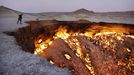 Darvaza 'Gates Of Hell' gas crater in Karakum Desert, Turkmenistan - 21 Jul 2012 2012-07-21 00:00:00 Mandatory Credit: Photo by Amos Chapple / Rex Features (1843563b) The Gates Of Hell It's known by locals as the 'gates of hell' and after a glimpse of the Darvaza gas crater it isn't difficult to see why. Located in Turkmenistan's Karakum Desert, the eerie cavern has been on fire for more than 40 years. It was discovered in 1971 by Soviet geologists when the ground beneath their drilling rig suddenly collapsed, leaving a large hole with a diameter of 70 metres (230 ft). As the huge crater was filled with potentially poisonous natural gas the decision was made to set it alight. Scientists expected it to burn itself out within a few days, but fast forward several decades and, amazingly, the fire is still as fierce as ever. At night the orange glow it produces can be seen for miles around and the heat attracts animals and insects to huddle close by. Meanwhile, when the wind gust across the crater it turns scaldingly hot - being likened to the 'opening of an enormous oven door'. MUST CREDIT PHOTOS BY: Amos Chapple / Rex Features For more information visit http://www.rexfeatures.com/stacklink/IUSRWMDCZ