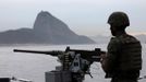 A Brazilian marine takes part in an exercise to prepare their operational readiness to combat terrorist attacks and riots ahead of the FIFA Confederations Cup and World Youth Day, on the Amazonas ship in Rio de Janeiro May 29, 2013. REUTERS/Sergio Moraes (BRAZIL - Tags: SPORT SOCCER MILITARY MARITIME) Published: Kvě. 29, 2013, 4:46 odp.