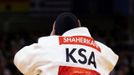 Saudi Arabia's Wojdan Shaherkani adjusts her headgear during her women's +78kg elimination round of 32 judo match against Puerto Rico's Melissa Mojica at the London 2012 Olympic Games August 3, 2012. REUTERS/Kim Kyung-Hoon (BRITAIN - Tags: SPORT JUDO SPORT OLYMPICS) Published: Srp. 3, 2012, 9:52 dop.