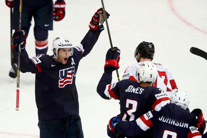 Craig Smith of the U.S. (L) celebrates the goal of team mate Tyler Johnson (R) against Switzerland during the third period of their men's ice hockey World Championship gr