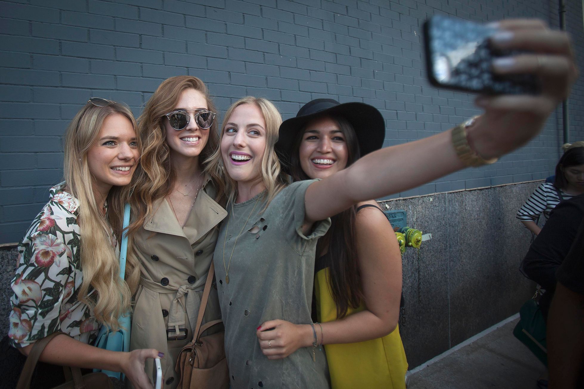People take a photo following the  Diane von Furstenberg Spring/Summer 2015 collection show during New York Fashion Week