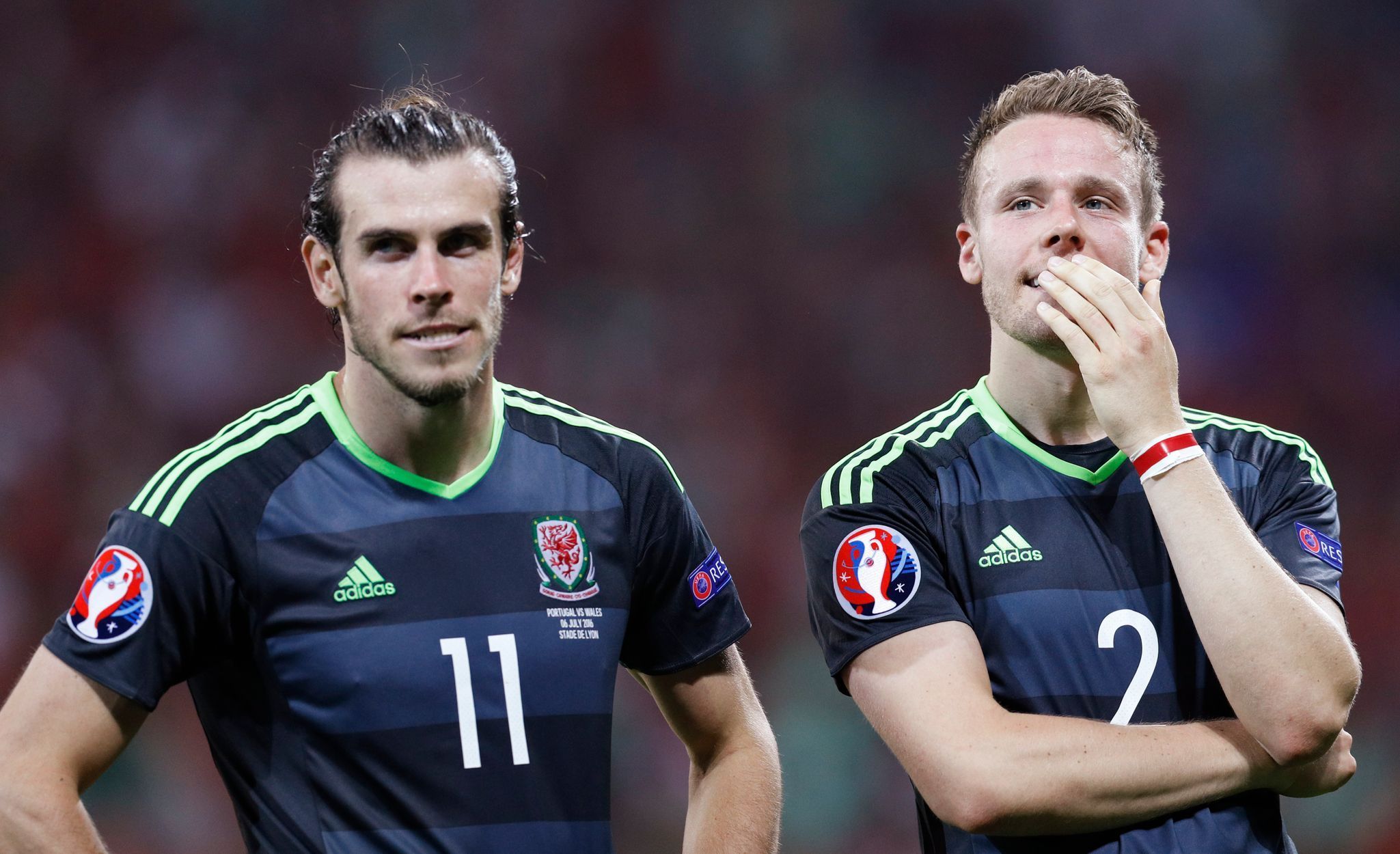 Wales' Gareth Bale and Chris Gunter react after the game