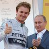 Russian President Putin applaudes Mercedes Formula One driver Rosberg of Germany after the first Russian Grand Prix in Sochi
