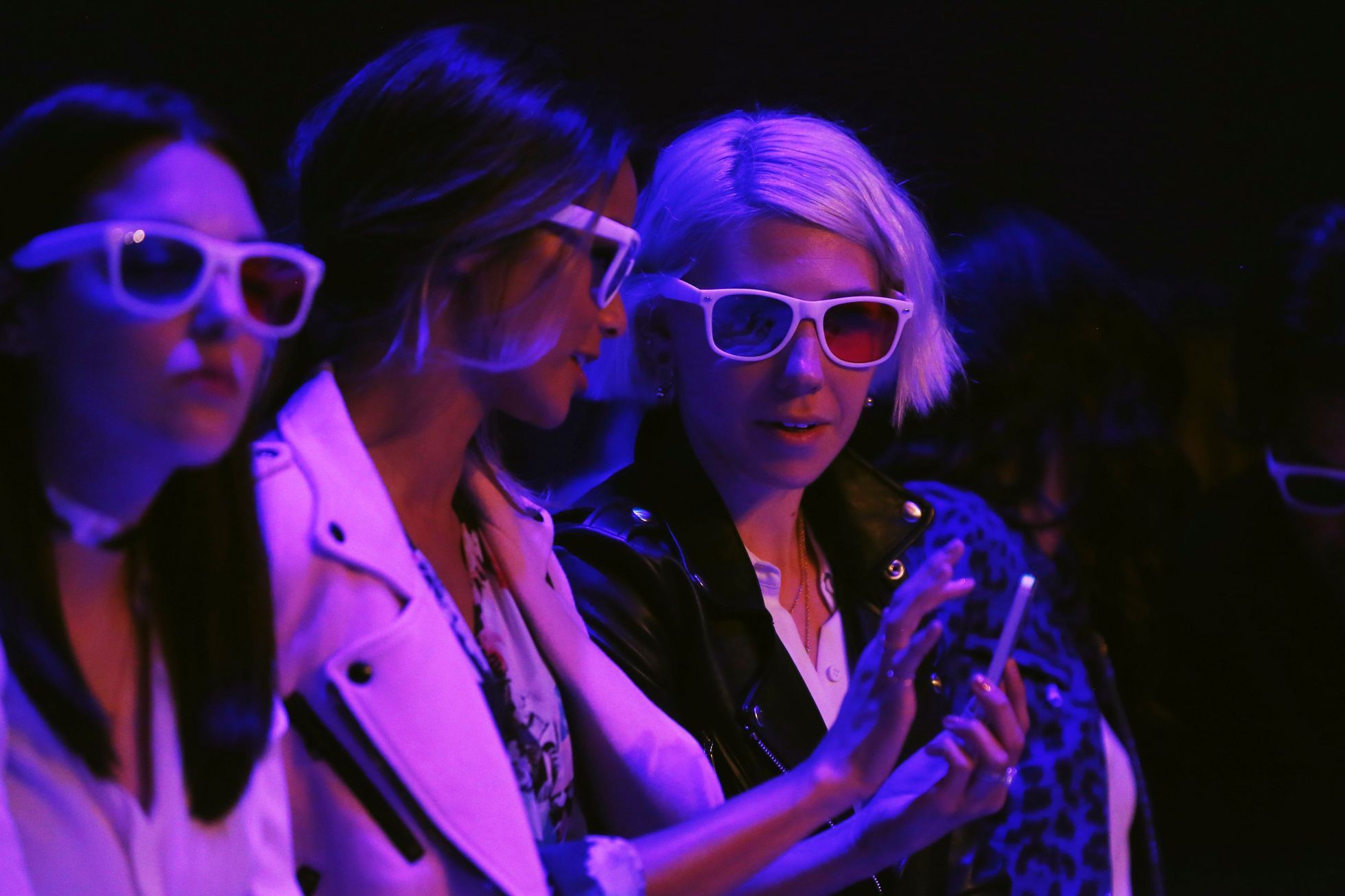 Actress Zosia Mamet wears 3-D glasses as she watches a presentation of Rebecca Minkoff's Spring/Summer 2015 collection during New York Fashion Week
