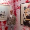 Curator Steve Lazarides poses for photograph at the Banksy: The Unauthorised Retrospective at Sotheby's S2 Gallery in London