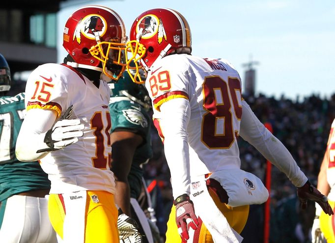 Oslava touchdownu Washingtonu Redskins ve stylu "berany, berany duc": Joshua Morgan (vlevo) a Santana Moss.