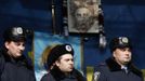 Police officers from Lviv who have arrived to join anti-government protesters appear on a stage in Independence Square in Kiev February 21, 2014.