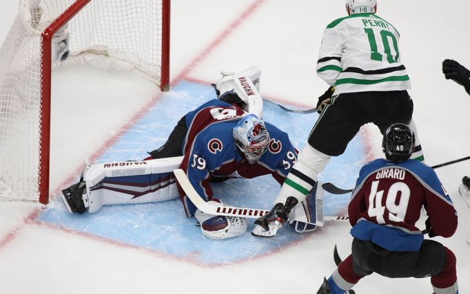 Aug 24, 2020; Edmonton, Alberta, CAN; Colorado Avalanche goaltender Pavel Francouz (39) covers the puck ahead of Dallas Stars right wing Corey Perry (10) during the first