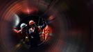 FILE PHOTO: Workers seen through a pipe at the construction site of the Nord Stream 2 gas pipeline, near the town of Kingisepp, Leningrad region, Russia, June 5, 2019. RE