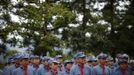 Mid-level government officials dressed in red army uniforms listen to a lesson as they visit an old house where former Chinese leader Mao Zedong used to live, during a five-day training course at the communist party school called China Executive Leadership Academy of Jinggangshan, in Jiangxi province September 21, 2012. China Executive Leadership Academy was established in 2005 by the Central Committee of the Communist Party of China, after the 16th Communist Party Congress in 2002. By the end of August 2012, the academy has held 789 training classes for almost 40,000 people. During the course, trainees listen and sing revolutionary songs, visit old revolutionary sites and review historical communist materials. China has yet to announce the starting date for the 18th Communist Party Congress, China's biggest political meeting in a decade, which will see the transfer of power from President Hu Jintao and Premier Wen Jiabao to a new generation. REUTERS/Carlos Barria (CHINA - Tags: POLITICS SOCIETY) Published: Zář. 21, 2012, 3:22 odp.