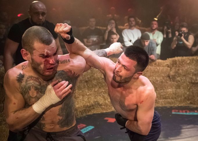 Danik Vesnenok and Danila Utenkov fight during the "Top Dog" bare-knuckle boxing tournament in Moscow, Russia April 16, 2021. Picture taken April 16, 2021. REUTERS/Shamil