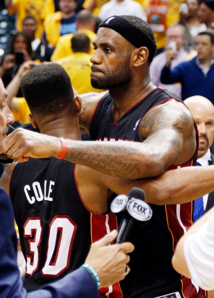 May 20, 2014; Indianapolis, IN, USA; Miami Heat forward LeBron James (6) hugs guard Norris Cole (30) after defeating the Indiana Pacers in game two of the Eastern Confere