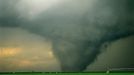 Close up image of large wedge tornado North East of Gruver Texas over green wheat field with Zimma Large Wedge Tornado North East of Gruver Texas over green wheat field. Rated F3 on the Fujita scale this tornado caused extensive damage in Oklahoma and Kansas although no deaths reported with this storm. Showing a Zimmatic advanced field irrigation control systems that utilize the most up-to-date computer technology for farming. Keywords Willett and Tornado to see other images of this same tornado or keyword Lightningsmiths to see my other tornado and severe weather images.