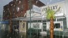 Sandbags try to hold back three to four feet of water in front of downtown businesses in Live Oak, Florida June 26, 2012. Tropical Storm Debby drifted slowly eastward over Florida's Gulf Coast on Tuesday, threatening to dump more rain on areas already beset by flooding. After stalling in the Gulf of Mexico, the storm was finally moving but was expected to take two more days to finish its wet slog across Florida. REUTERS/Phil Sears (UNITED STATES - Tags: ENVIRONMENT) Published: Čer. 26, 2012, 9:18 odp.