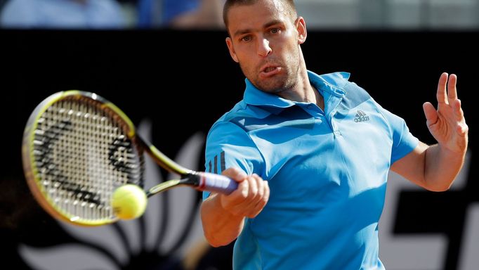 Mikhail Youzhny of Russia hits a return to Rafael Nadal of Spain during their men's singles match at the Rome Masters tennis tournament May 15, 2014. REUTERS/Max Rossi (I