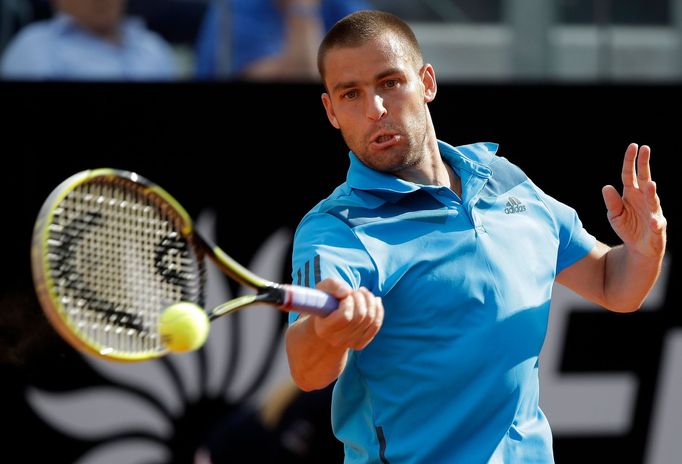 Mikhail Youzhny of Russia hits a return to Rafael Nadal of Spain during their men's singles match at the Rome Masters tennis tournament May 15, 2014. REUTERS/Max Rossi (I