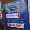 Chelsea stadium worker changes wooden fixture board to next match following tonights Champion's League semi-final second leg soccer match against Atletico Madrid in London