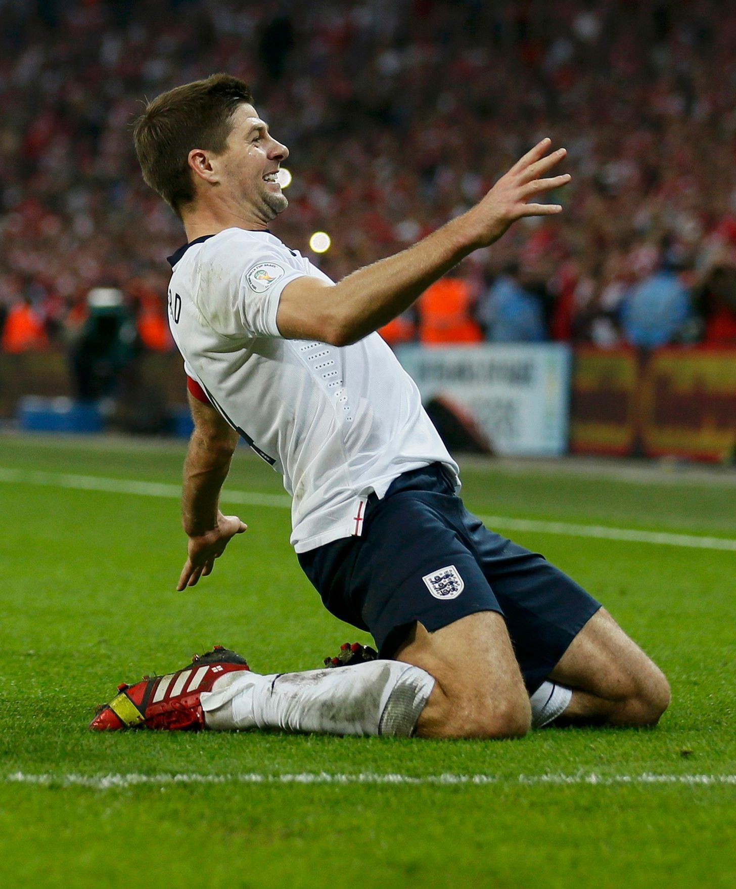 England captain Steven Gerrard celebrates his goal during their 2014 World Cup qualifying soccer match against Poland at Wembley Stadium in London