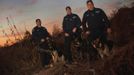 New York City Police Department (NYPD) officers (R-L) Anthony Compitello, Chris Theofield and Benjamin Colecchia with their dogs Cesar, Brutas and Timoshenko pose for a portrait on Staten Island where they and others performed dozens of searches for victims after Hurricane Sandy November 14, 2012. Ten NYPD K9 teams answered hundreds of calls to search for residents throughout the five boroughs of New York City including Staten Island where 23 of the 43 deaths from the storm occurred. Picture taken November 14, 2012. REUTERS/Mike Segar (UNITED STATES - Tags: DISASTER ENVIRONMENT) ATTENTION EDITORS PICTURE 12 OF 19 FOR PACKAGE 'SURVIVING SANDY' SEARCH 'SEGAR SANDY' FOR ALL PICTURES Published: Lis. 20, 2012, 3:31 odp.