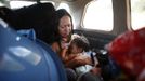 The wife of an illegal miner flies on a Cessna plane into the mining area in the southern state of Bolivar November 16, 2012. In the triangle that connects Venezuela, Brazil and Guyana a huge number of illegal gold and diamonds prospectors or garimpeiros dream of changing their lives overnight by finding a huge bonanza. Picture taken November 16, 2012. REUTERS/Jorge Silva (VENEZUELA - Tags: BUSINESS EMPLOYMENT SOCIETY) ATTENTION EDITORS: PICTURE 13 OF 20 FOR PACKAGE 'DIAMONDS IN THE JUNGLE'. TO FIND ALL IMAGES SEARCH 'DIAMONDS PROSPECTORS' Published: Pro. 3, 2012, 10:02 dop.