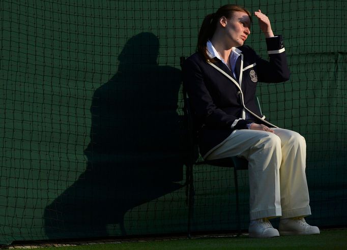 A line judge sits on court one at the Wimbledon Tennis Championships, in London June 25, 2013. REUTERS/Toby Melville (BRITAIN - Tags: SPORT TENNIS)