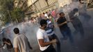 Members of the Muslim Brotherhood and supporters of ousted Egyptian President Mohamed Mursi run after riot police released tear gas along a road at Kornish El Nile, which leads to Tahrir Square, during clashes at a celebration marking Egypt's 1973 war with Israel in Cairo October 6, 2013. Thousands of supporters of deposed Egyptian President Mohamed Mursi marched through Cairo on Sunday towards Tahrir Square, where pro-army supporters gathered to celebrate the anniversary of an attack on Israeli forces in 1973.