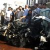 Zbytky minibusu po explozi v Kufě