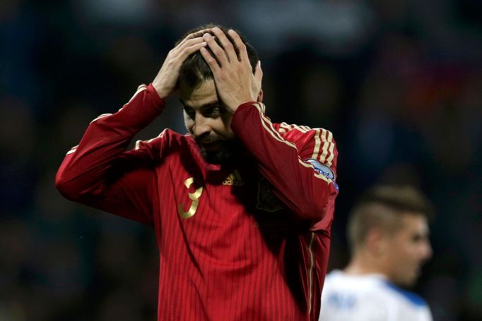 Pique of Spain reacts during their Euro 2016 qualification soccer match against Slovakia at the MSK stadium in Zilina